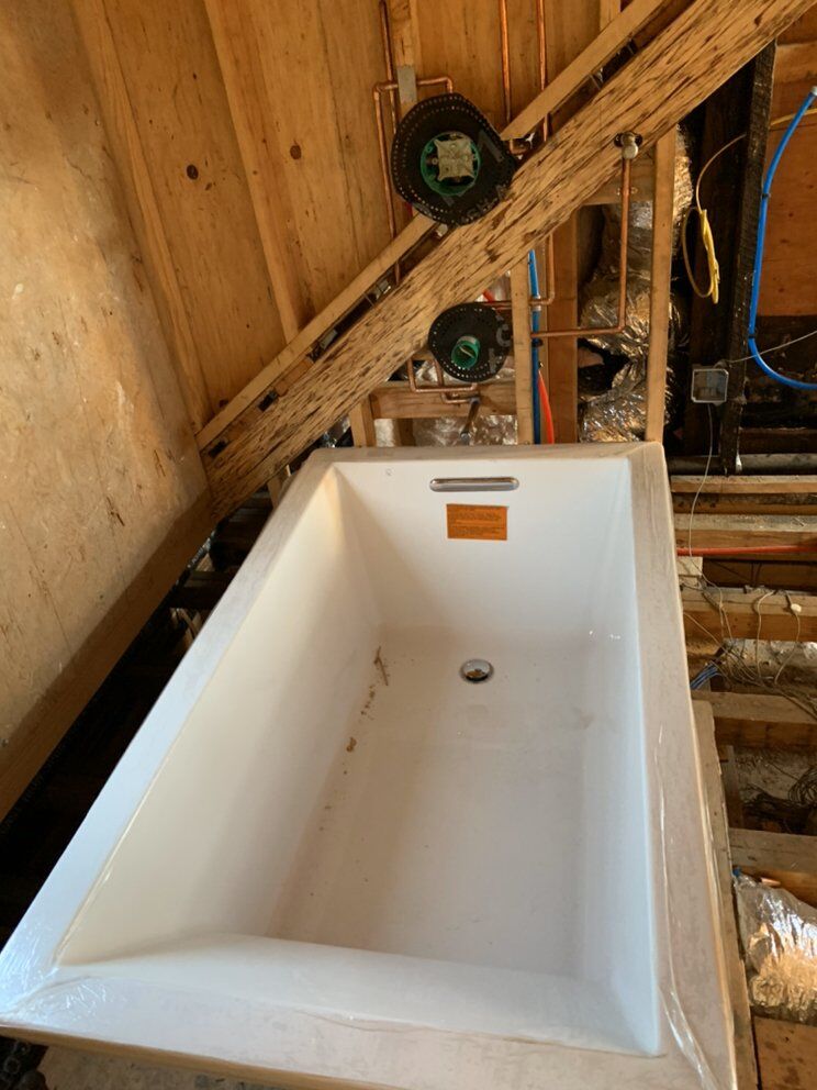 Fixture set with rough-in valves before close-up