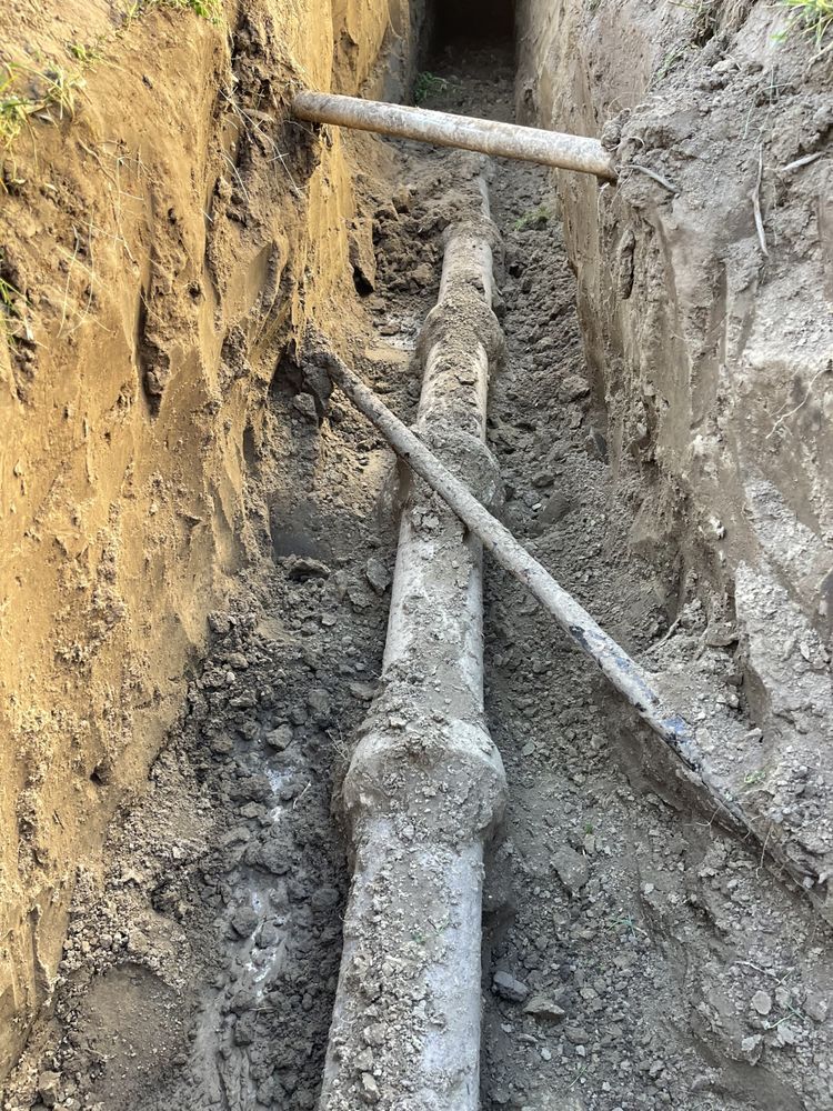 Buried main exposed in an open trench